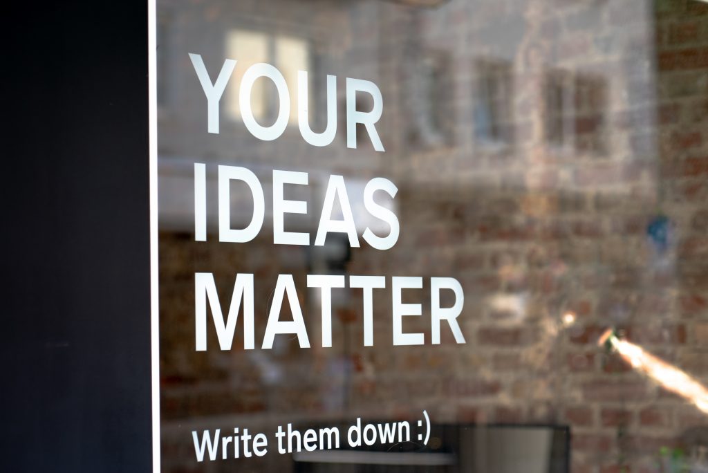 Your Ideas Matter! Write them down :)A motivational quote on a coworking space.