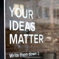 Your Ideas Matter! Write them down :)A motivational quote on a coworking space.